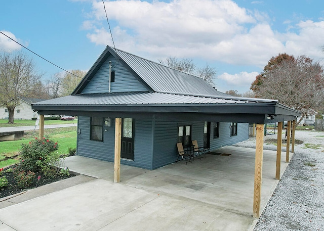 view of side of property featuring a carport