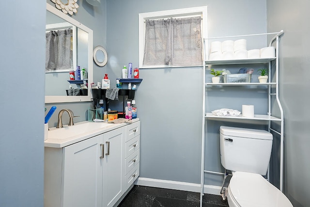 bathroom with vanity and toilet