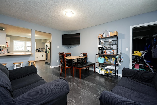 living room featuring a textured ceiling