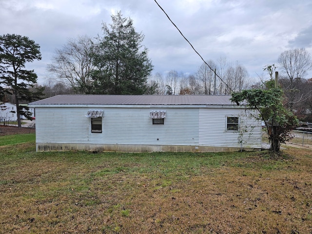 view of home's exterior featuring a yard