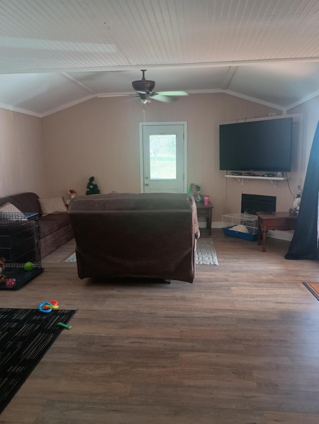 bedroom with ceiling fan, wood-type flooring, lofted ceiling, and ornamental molding