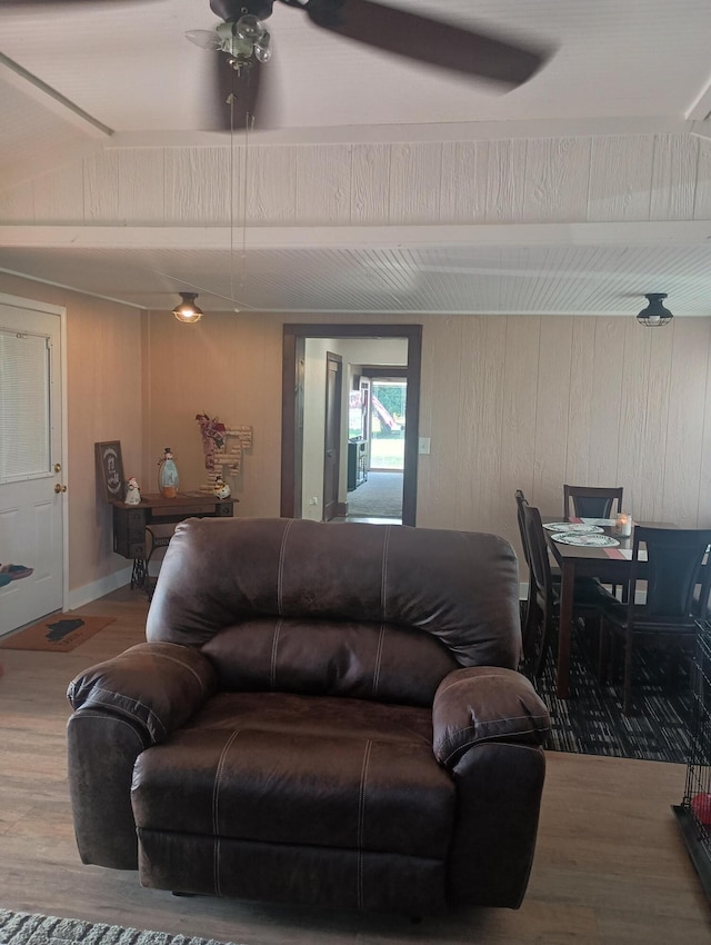 living room with hardwood / wood-style flooring and ceiling fan