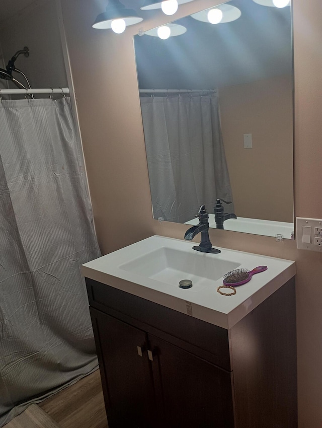 bathroom with wood-type flooring and vanity