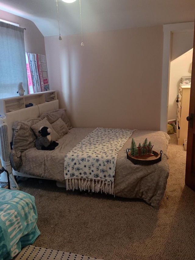 bedroom with carpet flooring and vaulted ceiling