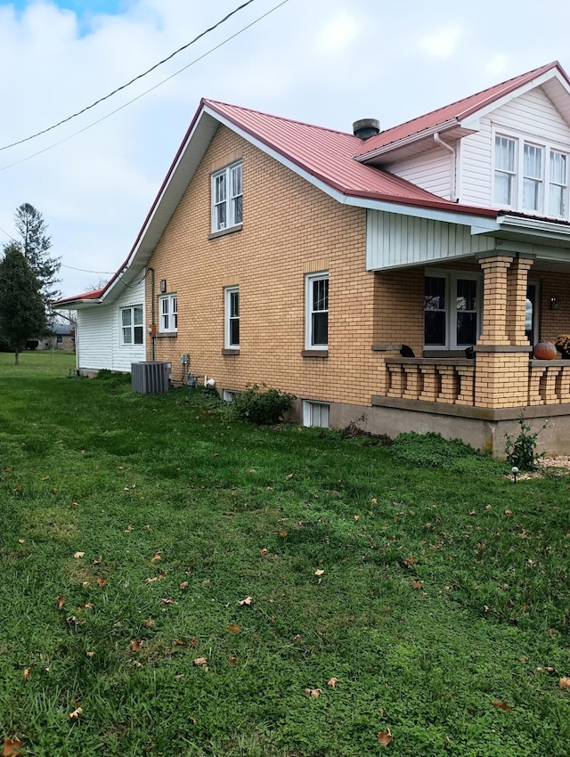 view of property exterior featuring a yard and central air condition unit