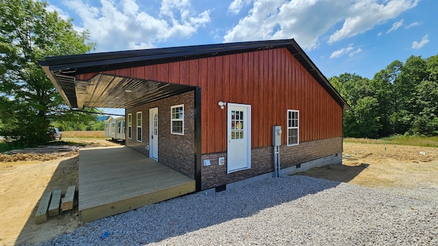 view of property exterior featuring a wooden deck