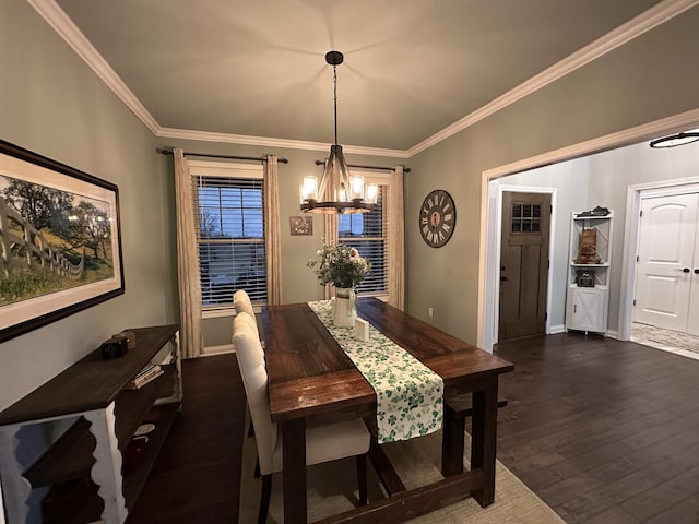 dining space featuring a chandelier, crown molding, dark wood-type flooring, and baseboards