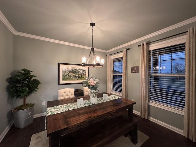 dining space featuring baseboards, dark wood-type flooring, a chandelier, and ornamental molding