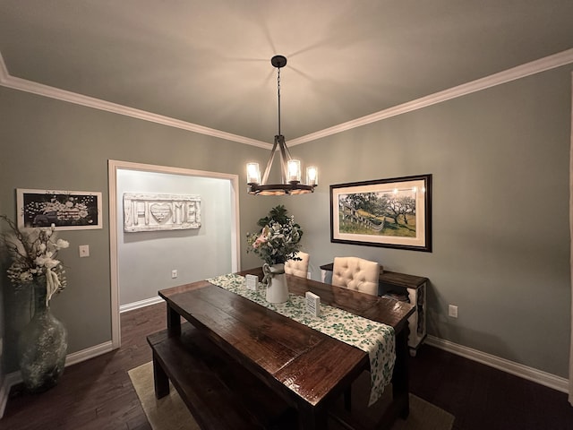 dining area with dark wood finished floors, a notable chandelier, crown molding, and baseboards