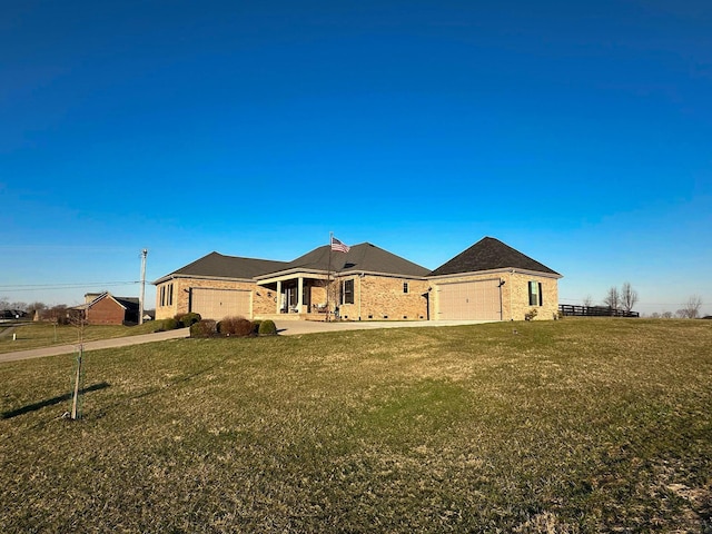 ranch-style house with an attached garage and a front yard