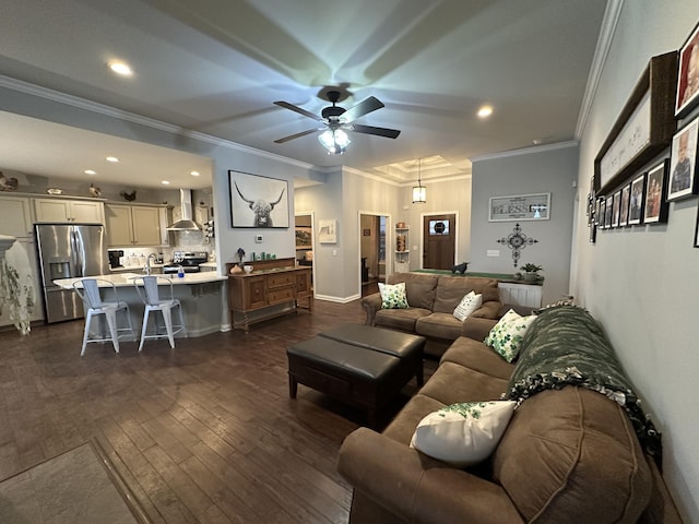 living room featuring crown molding, baseboards, ceiling fan, dark wood finished floors, and recessed lighting