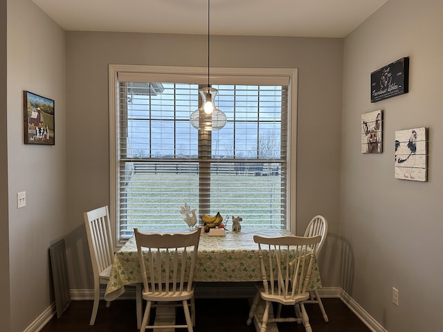 dining room featuring baseboards