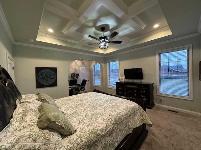 carpeted bedroom with visible vents, baseboards, coffered ceiling, arched walkways, and ornamental molding