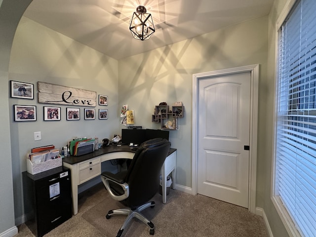 office featuring baseboards and dark colored carpet