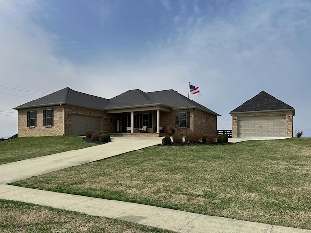 view of front of property featuring driveway, brick siding, and a front yard