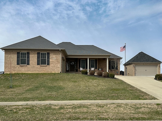 view of front of house with brick siding, covered porch, concrete driveway, and a front yard