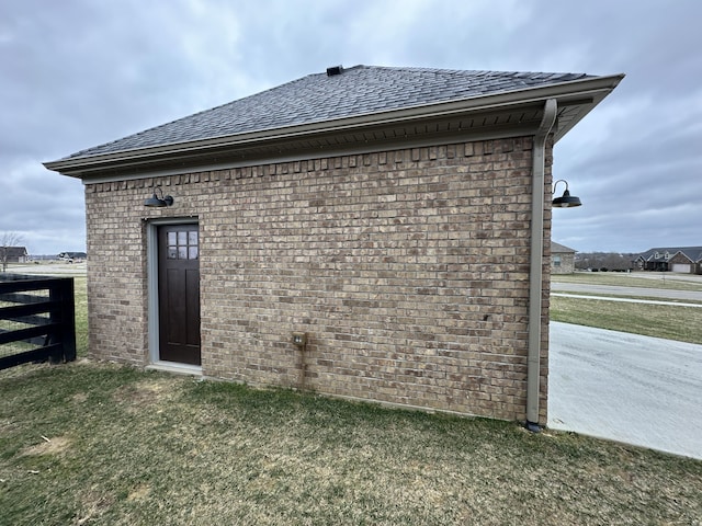 view of outbuilding with fence