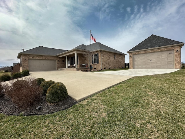 ranch-style house with a front yard, driveway, roof with shingles, a garage, and brick siding