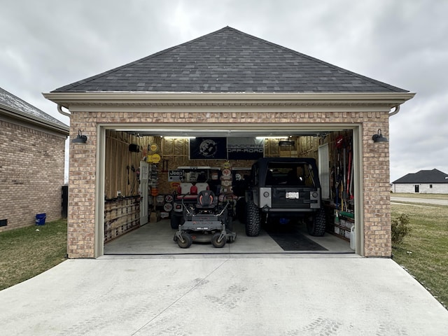 garage with concrete driveway