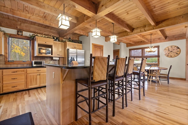 100 Waters Edge Trl, Monticello, KY 42633 - kitchen with stainless steel appliances, light wood-type flooring, wooden ceiling with exposed beams, dark countertops, and tasteful backsplash