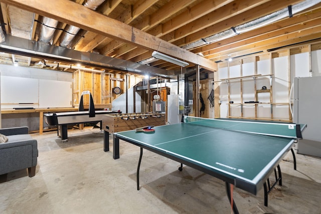 playroom featuring unfinished concrete floors