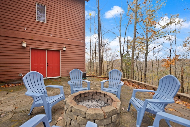 view of patio / terrace with an outdoor fire pit