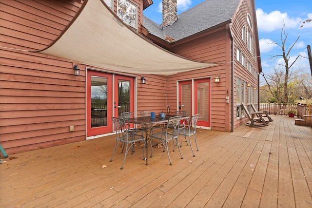 deck with outdoor dining area