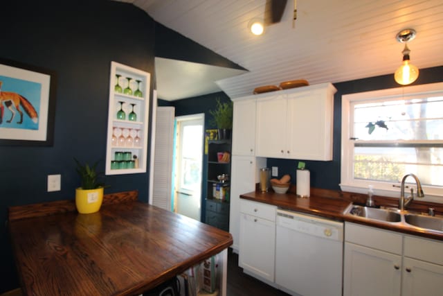 kitchen featuring white cabinetry, dishwasher, sink, wooden counters, and vaulted ceiling