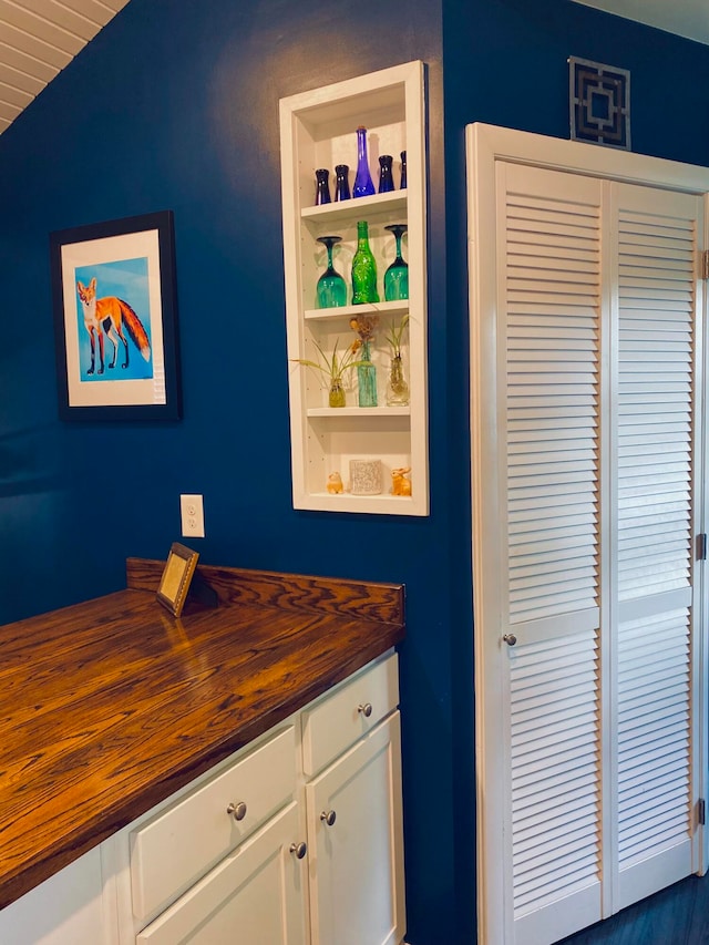 bathroom featuring vaulted ceiling