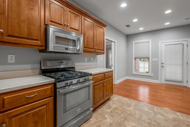 kitchen featuring light wood-type flooring and stainless steel appliances