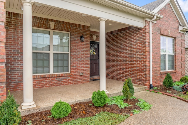 entrance to property featuring covered porch