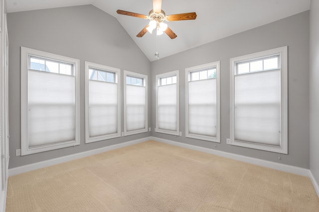 unfurnished sunroom featuring ceiling fan and lofted ceiling