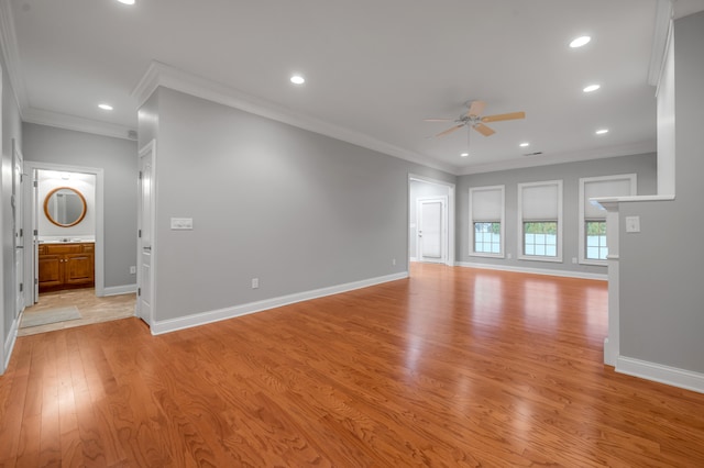 unfurnished living room with light hardwood / wood-style flooring, ceiling fan, and crown molding