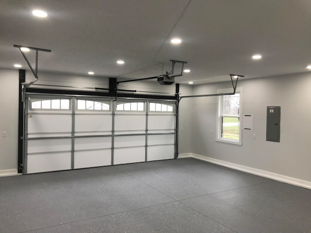 garage with electric panel and a garage door opener