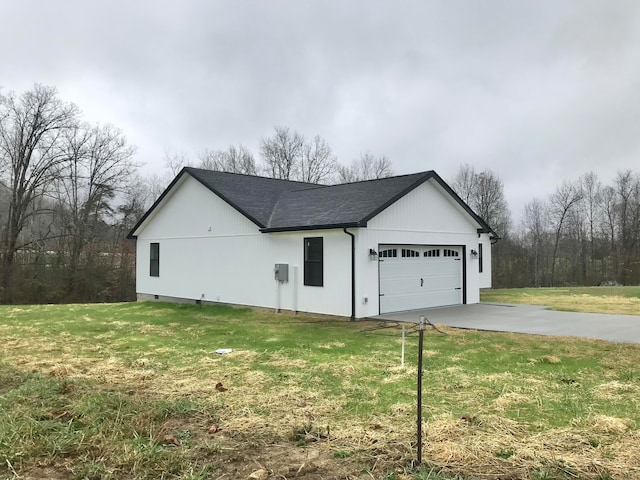 view of home's exterior featuring a yard and a garage