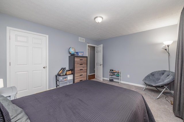 carpeted bedroom featuring baseboards