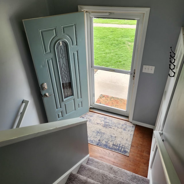 entrance foyer featuring wood finished floors and baseboards