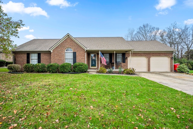 ranch-style house featuring a front lawn and a garage