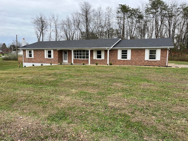 ranch-style house featuring a front lawn