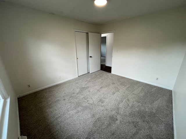 unfurnished room featuring carpet flooring