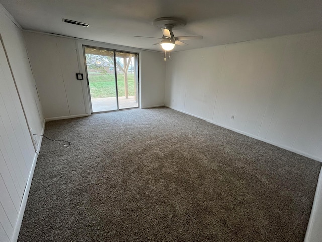 empty room featuring ceiling fan and carpet floors