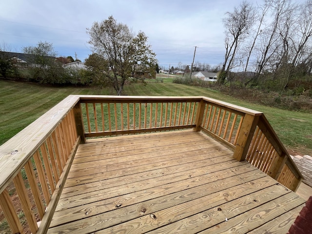 wooden deck featuring a yard