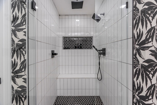 bathroom featuring tiled shower