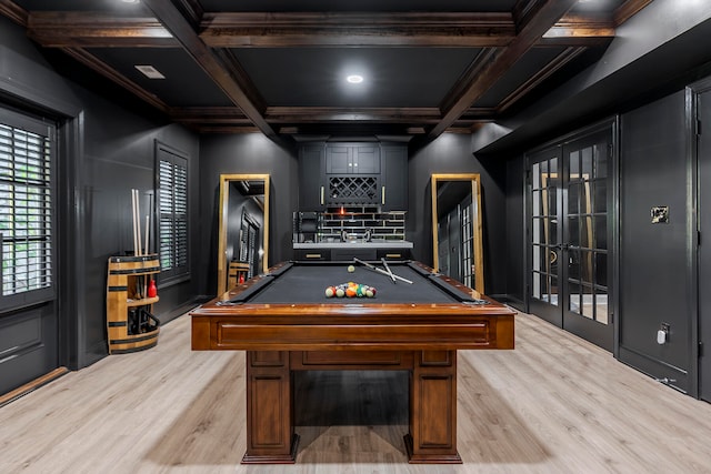 rec room featuring french doors, light hardwood / wood-style floors, coffered ceiling, and pool table