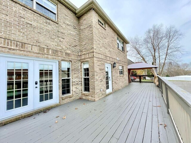 wooden deck with a yard