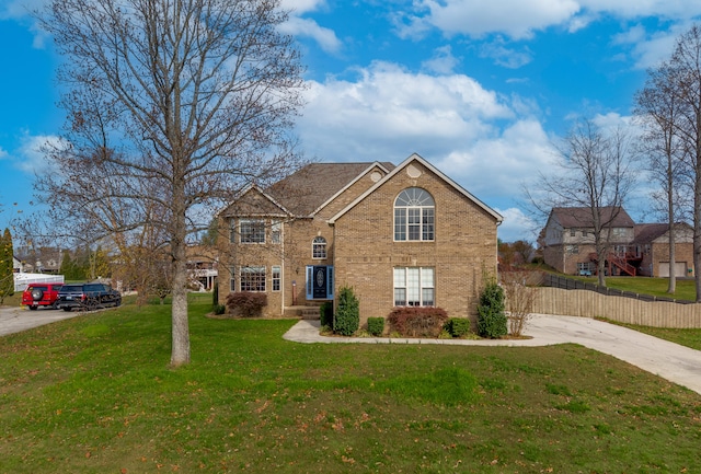 front facade with a front yard