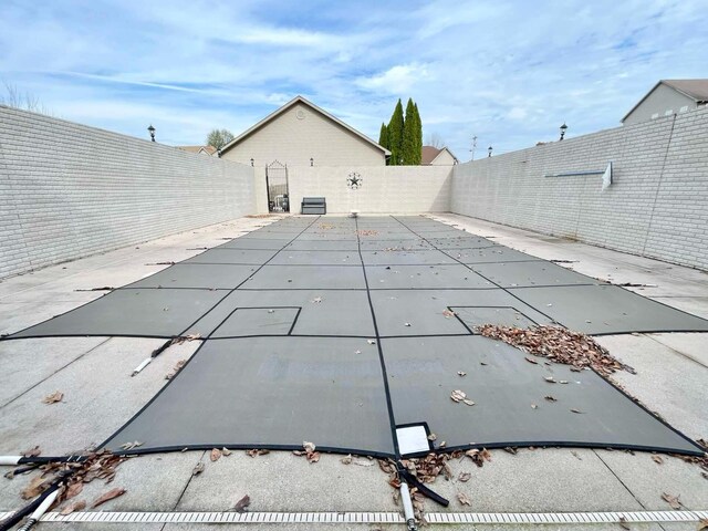 view of swimming pool with a lawn and a patio