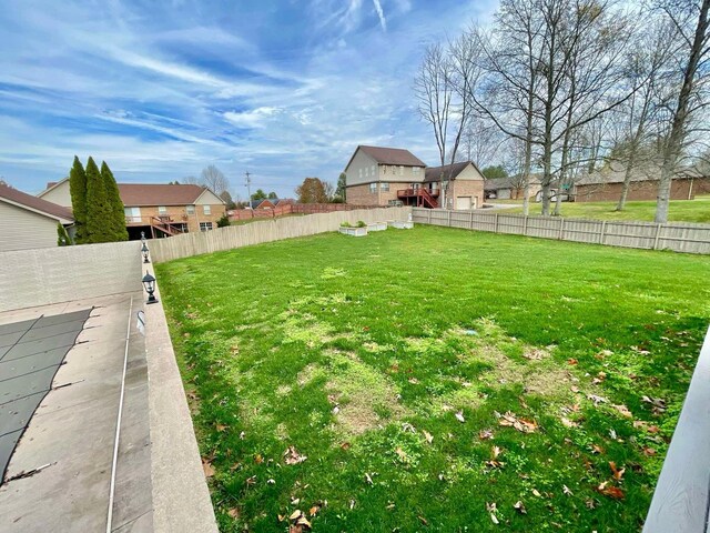 view of yard featuring a wooden deck