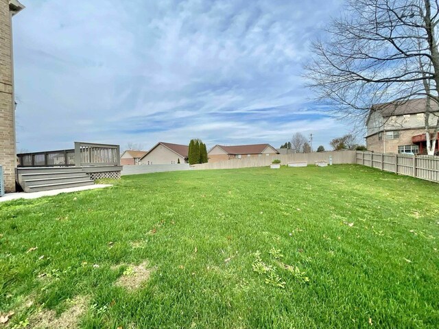 back of property featuring a yard and a patio