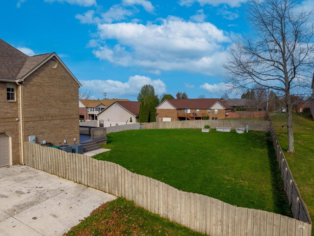 view of home's exterior with a garage and a yard